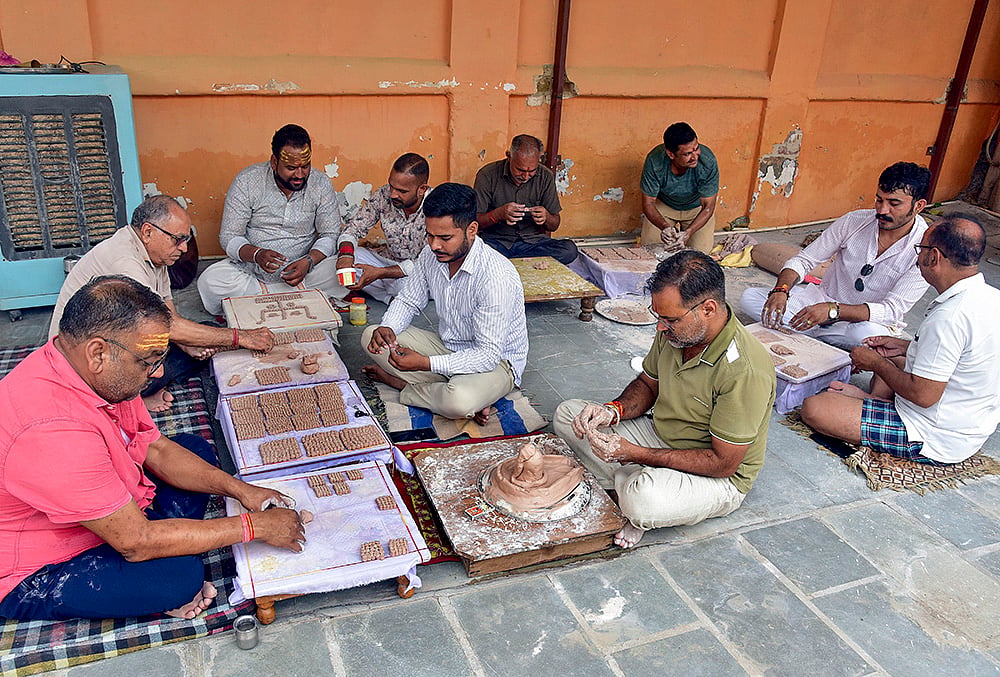 Devotees create miniature Shiva Lingas during Shravan