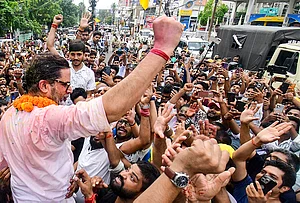 | Photo: PTI : Jan Suraaj Party chief Prashant Kishor celebrates with supporters after taking the lead in the Bankipur Assembly by-election during the counting of votes, in Patna.