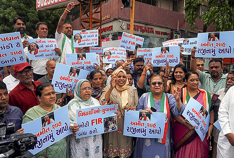 Congress workers raise slogans during a protest over the NEET paper leak, demanding the resignation of Union Home Minister Amit Shah, in Ahmedabad, Gujarat.