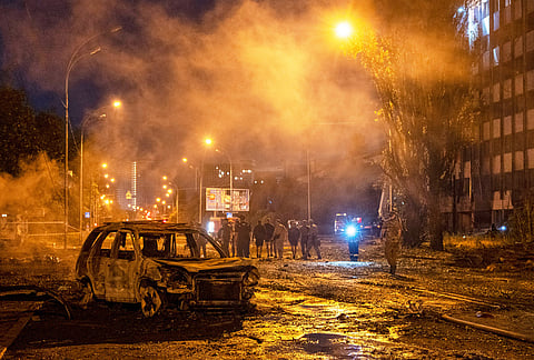 A burned car is seen after a Russian missile attack in Kyiv, Ukraine, Saturday, Aug. 1, 2026.