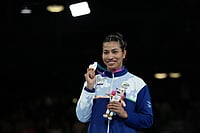 | Photo: AP/Eranga Jayawardena : India's Lovlina Borgohain, silver medalist, poses for photos during the medal ceremony for women's 75kg boxing at the Commonwealth Games in Glasgow, Scotland.