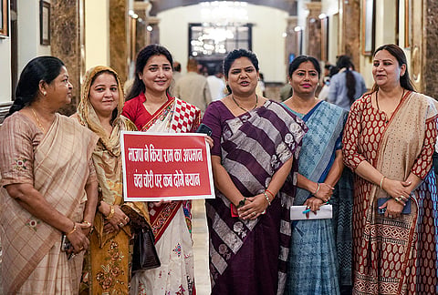 Samajwadi Party MLAs Ragini Sonker, Pallavi Patel and others stage a protest over the Ram temple donation theft issue during the Monsoon session of the Uttar Pradesh Legislative Assembly, in Lucknow.