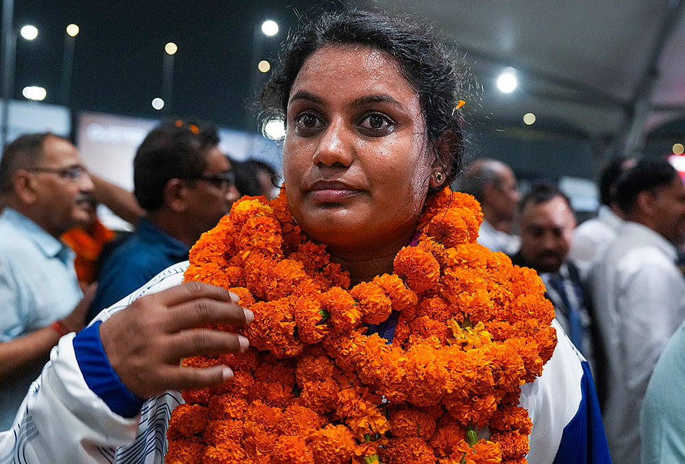 Athletes arrival airport photos India Para-athlete bronze medallist Shilpa K Shyla