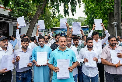 | Photo: PTI/Salman Ali : Demonstrators showing petitions to be submitted during a protest march by AAP national convener Arvind Kejriwal to the Prime Minister’s residence against E20 fuel, alleging the centre is promoting it under pressure from US President Donald Trump, at party office, in New Delhi, Tuesday, Aug. 4, 2026.