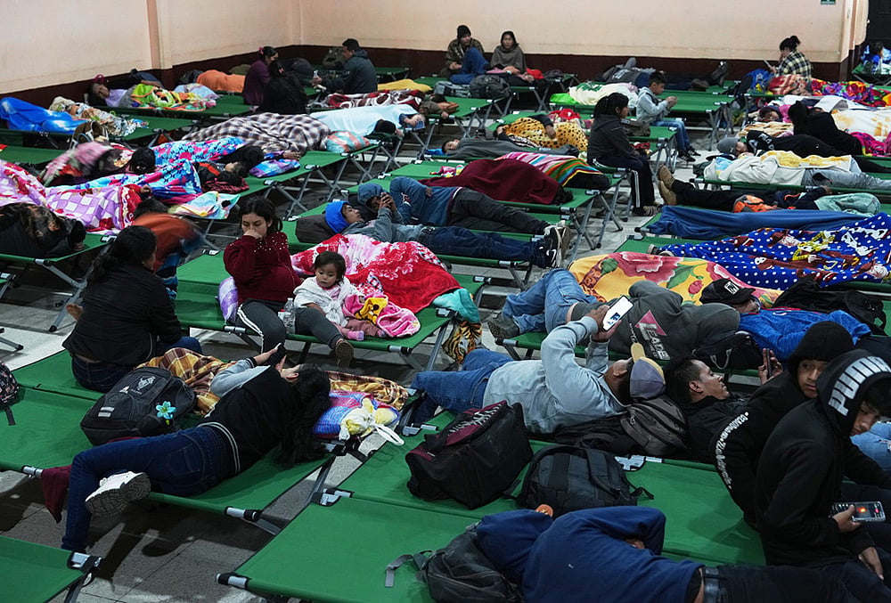 Families evacuated from areas surrounding the Fuego Volcano rest at a temporary shelter in San Juan Alotenango, Guatemala, Tuesday, Aug. 4, 2026. 