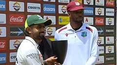 Pakistan captain Babar Azam posing alongside West Indies skipper Roston Chase as they share the tropy - X