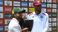 West Indies Vs Pakistan, 2nd Test 2026: Abdullah Shafique, Sajid Khan Star As Babar Azam & Co. Level Series 1-1 X : Pakistan captain Babar Azam posing alongside West Indies skipper Roston Chase as they share the tropy