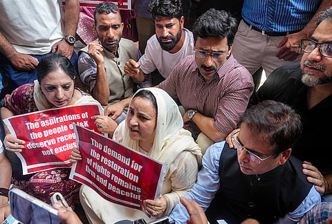 Jammu and Kashmir Cabinet Minister Sakina Itoo along with JKNC chief Spokesperson Tanvir Sadiq and party leaders stage a protest on the seventh anniversary of the abrogation of Article 370, demanding the restoration of the special status of the erstwhile state of J-K, in Srinagar, Wednesday, Aug. 5, 2026. 