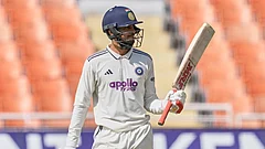 India's captain Shubman Gill celebrates his fifty runs on day one of the cricket test match between Afghanistan and India in New Chandigarh. - | Photo: AP/Ashwini Bhatia