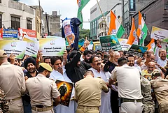 Police personnel stop Jammu and Kashmir Pradesh Congress (JKPC) Working President Raman Bhalla and other party workers after they take out a protest rally on the seventh anniversary of the abrogation of Article 370. - | Photo: PTI