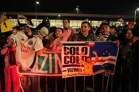 Fans of Colo-Colo react as Cape Verde goalkeeper Vozinha arrives at the airport ahead of a move to Colo-Colo in Santiago, Chile.