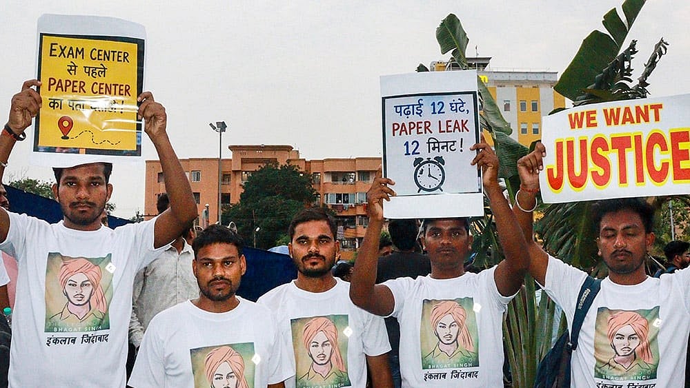 Students gather during a protest over alleged irregularities in the 14th JPSC examination, JSSC-CGL and other recruitment tests, demanding a CBI probe and reforms in the recruitment agencies, in Ranchi, Jharkhand, Sunday, Aug. 2, 2026.  - | Photo: PTI