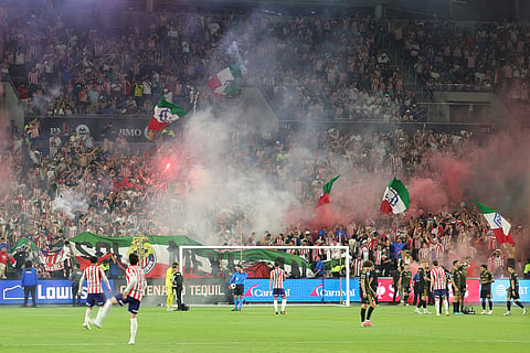 Chivas Guadalajara fans light flares during the second half of a Leagues Cup soccer match between Los Angeles FC and Chivas Guadalajara  in Los Angeles.