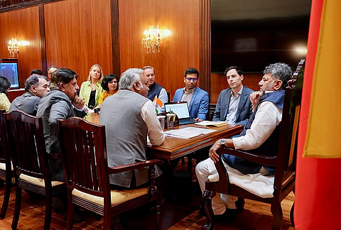 Karnataka Chief Minister DK Shivakumar during a meeting with Head of International Policy at Anthropic Michael Sellito and the senior global delegation from Anthropic, in the presence of state Information and Technology Minister Priyank Kharge, Financial Adviser L. K. Atheeq and others during a meeting, at Vidhana Soudha, in Karnataka. 