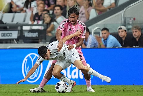 Atletico de San Luis midfielder Ronaldo Najera, front, clashes with Inter Miami midfielder Telasco Segovia during the second half of a Leagues Cup soccer match, Wednesday, Aug. 5, 2026, in Miami.