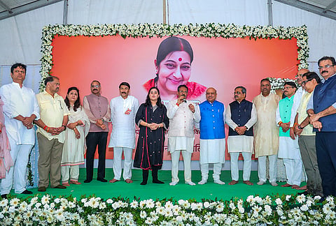 Delhi Assembly Speaker Vijender Gupta looks on as Delhi BJP President Harsh Malhotra addresses an event organised on the death anniversary of former external affairs minister and party leader Sushma Swaraj, in New Delhi. BJP MPs Bansuri Swaraj, Manoj Tiwari, party MLA Shikha Roy and others are also present. 
