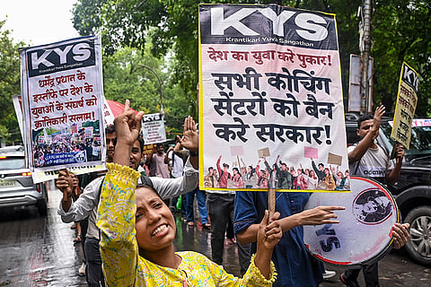 Krantikari Yuva Sangathan (KYS) supporters hold placards and stage a protest against various demands, at the Arts Faculty, North Campus, in New Delhi.