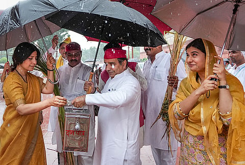 Samajwadi Party MPs Dimple Yadav, Dharmendra Yadav, Iqra Choudhary and others stage a protest over the alleged embezzlement of donations at Ayodhya’s Shri Ram Janmbhoomi Temple during the ongoing Monsoon session of Parliament, amid rainfall, in New Delhi.
