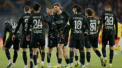 PSG's players celebrate after Khvicha Kvaratskhelia, unseen, scored the opening goal during the French League One soccer match between Lens and Paris Saint Germain, in Lens, northern France.
- | Photo: AP/Jean-Francois Badias