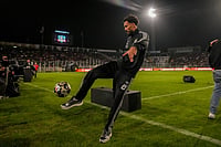 | Photo: AP/Esteban Felix : Cape Verde goalkeeper Vozinha kicks a soccer ball to Colo Colo supporters at his welcoming event at the Monumental Stadium in Santiago, Chile.