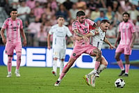 | Photo: AP/Rebecca Blackwell : Inter Miami midfielder Rodrigo de Paul, center, battles with Atletico de San Luis midfielder Sebastien Salles-Lamonge for the ball during the second half of a Leagues Cup soccer match, Wednesday, Aug. 5, 2026, in Miami.