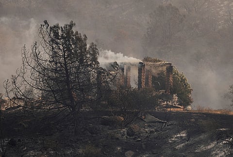 A structure destroyed by the Gann Fire is seen on a hilltop near Angels Camp in Calaveras County, California, Tuesday, Aug. 4, 2026. 