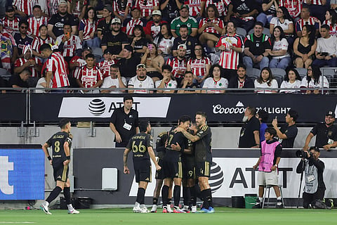 Los Angeles FC forward Denis Bouanga celebrates with teammates after scoring his sides first goal during the first half of a Leagues Cup soccer match against the Chivas Guadalajara in Los Angeles.