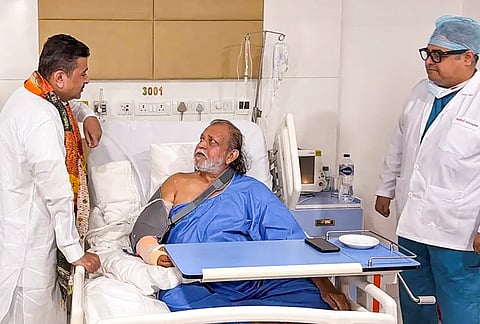 West Bengal Chief Minister Suvendu Adhikari interacts with actor Mithun Chakraborty during a visit to a private hospital after the actor underwent treatment on Thursday, in Kolkata. 
