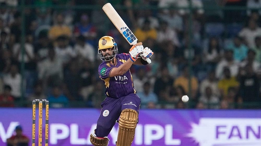 Photo: AP/Manish Swarup : Kolkata Knight Riders captain Ajinkya Rahane plays a shot during the Indian Premier League cricket match between Delhi Capitals and Kolkata Knight Riders in New Delhi, India.