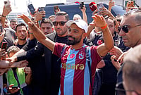 | Photo: Samet Yalcin/DIA Photo via AP : Egypt's Mohamed Salah wearing his new Trabzonspor team jersey gestures to supporters as he arrives at the airport in Istanbul, Turkey, Wednesday, Aug. 5, 2026. 