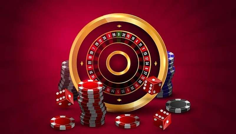 Casino roulette wheel with dice and stacks of chips