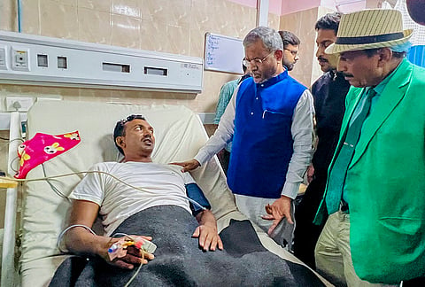 LoP in Jharkhand Assembly Babulal Marandi interacts with a student after the latter was admitted to a hospital as his health condition deteriorated during a hunger strike over the alleged irregularities of exams and paper leak of Jharkhand Public Service Commission (JPSC) and Jharkhand Staff Selection Commission (JSSC), in Ranchi.