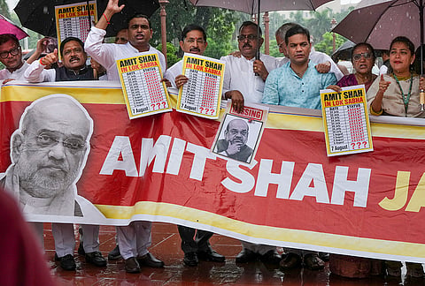 Congress MPs Praniti Shinde, Hibi Eden, and others stage a protest during the Monsoon session of Parliament amid rainfall, in New Delhi.