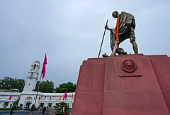 A statue of Mahatma Gandhi stands outside the Delhi Legislative Assembly during the Monsoon session, in New Delhi. - | Photo: PTI/Salman Ali