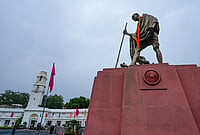 Day In Pics: August 07, 2026 | Photo: PTI/Salman Ali : A statue of Mahatma Gandhi stands outside the Delhi Legislative Assembly during the Monsoon session, in New Delhi.