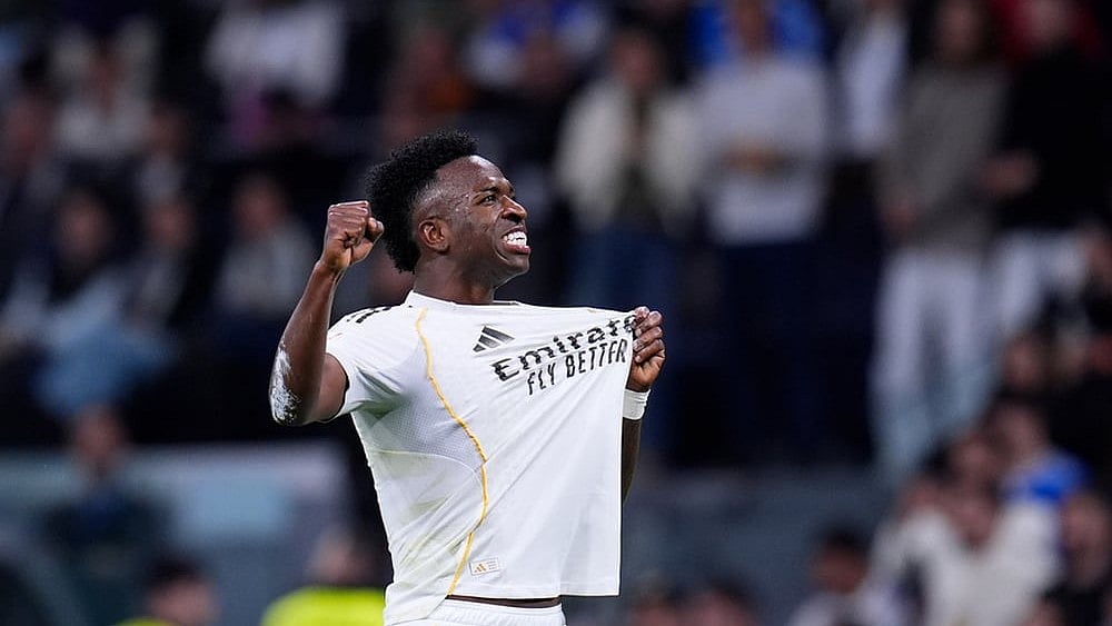 Real Madrid's Vinicius Junior celebrates after scoring his side's third goal during the Spanish La Liga soccer match between Real Madrid and Atletico Madrid in Madrid, Spain. - | Photo: AP/Manu Fernandez