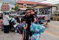 In Photos: Thailand School Shooting Tragedy, At Least 8 Dead | Photo: AP/Wason Wanichakorn : A man carries schoolgirls outside the site of a school shooting in Thailand's Nonthaburi province, Friday, Aug. 7, 2026.