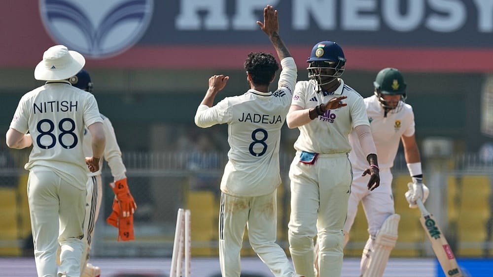 | Photo: AP/Anupam Nath : India's Ravindra Jadeja, centre, celebrates with teammates after the dismissal of South Africa's Aiden Markram on the fourth day of the second cricket test match between India and South Africa in Guwahati.