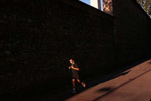 A man jogs as the sun rises on a summer day in Istanbul, Turkey, Wednesday, July 29, 2026. 