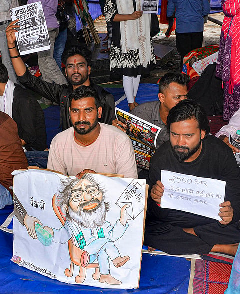 Students and aspirants hold placards and stage an indefinite protest against the Jharkhand Government regarding the irregularities of exams and paper leak of Jharkhand Public Service Commission (JPSC) and Jharkhand Staff Selection Commission (JSSC), at Jaipal Singh Stadium, in Ranchi, Thursday, Aug. 6, 2026. 
