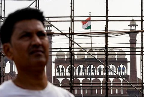 Security personnel stand atop of Red Fort during the rehearsal ahead of Independence Day celebrations, in New Delhi. 
