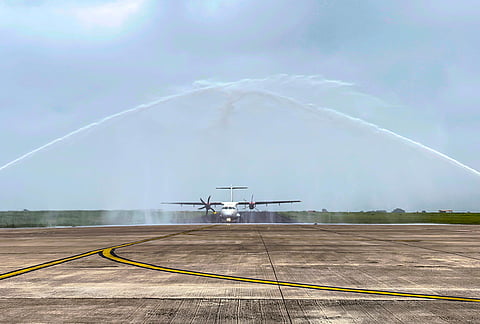 The inaugural flight from Kolkata receives a water cannon salute upon its arrival at Dumna Airport in Jabalpur district, Madhya Pradesh.