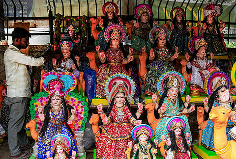An artist gives a finishing touch to an idol of Goddess Dashama at a workshop ahead of Dashama Vrat festival, in Ahmedabad, Gujarat.