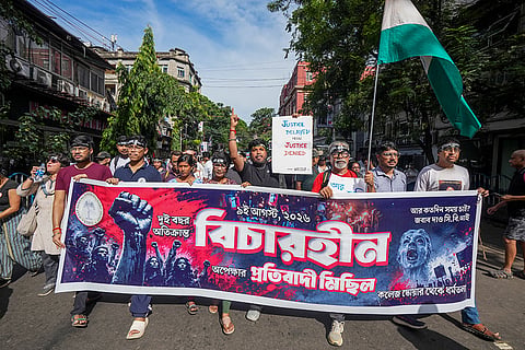 Members of the West Bengal Junior Doctors' Front (WBJDF) during a protest rally marking the completion of two years since the rape and murder of the postgraduate trainee doctor 'Abhaya' at RG Kar Medical College and Hospital, in Kolkata, West Bengal.