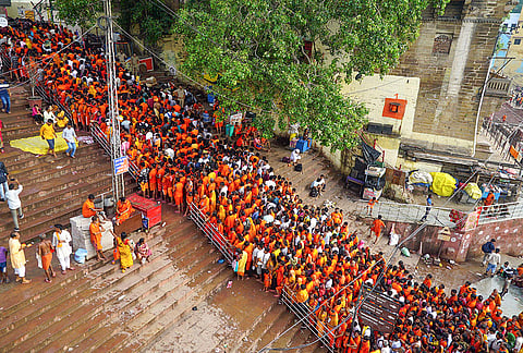 People gather to offer prayers to Lord Shiva at Kashi Vishwanath temple on the second Monday of the month of 'Shravan', in Varanasi, Uttar Pradesh.