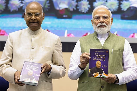 In this image received on Aug. 12, 2026, Prime Minister Narendra Modi with former president Ram Nath Kovind during the launch of latter's autobiography, 'Triumph of the Indian Republic: My Life, My Struggles', in New Delhi.