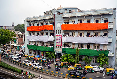 Students stand along the balconies of Anjuman-e-Islam School decorated in the colours of the national flag ahead of Independence Day celebrations, in Ahmedabad, Gujarat.