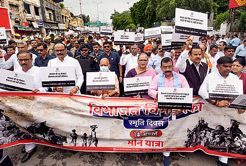 Uttar Pradesh Chief Minister Yogi Adityanath and others take part in a rally from Sardar Vallabhbhai Patel Statue site at GPO to Lok Bhavan to observe 'Partition Horrors Remembrance Day', in Lucknow. 
