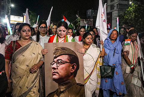 West Bengal Minister Agnimitra Paul holds a portrait of freedom fighter Netaji Subhash Chandra Bose along with state BJP leaders and actor Rituparna Sengupta during a rally 'Freedom Beyond Midnight', a midnight walkathon for women’s safety, in Kolkata.