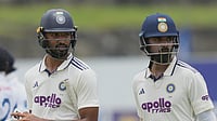 Eranga Jayawardena/AP Photo : India's Devdutt Padikkal, left, and KL Rahul leave the field for lunch break during the day one of the first cricket test match between Sri Lanka and India in Galle